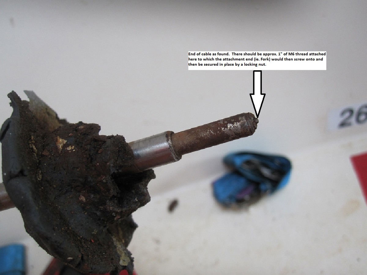End of failed cable as found. There should be approx. 1″ of M6 thread attached here, to which the attachment end (i.e. fork) would then screw on and then be secured in place by a locking nut