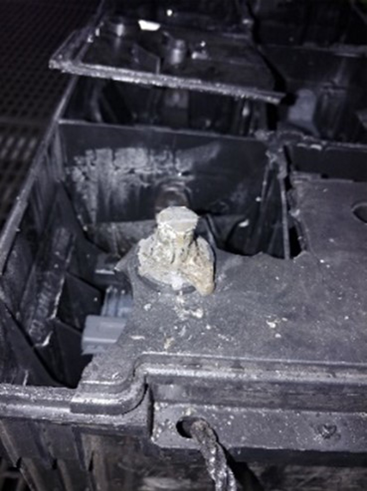 one of the batteries in the bank for the generator had suffered a critical failure resulting in the top of the battery case being destroyed
