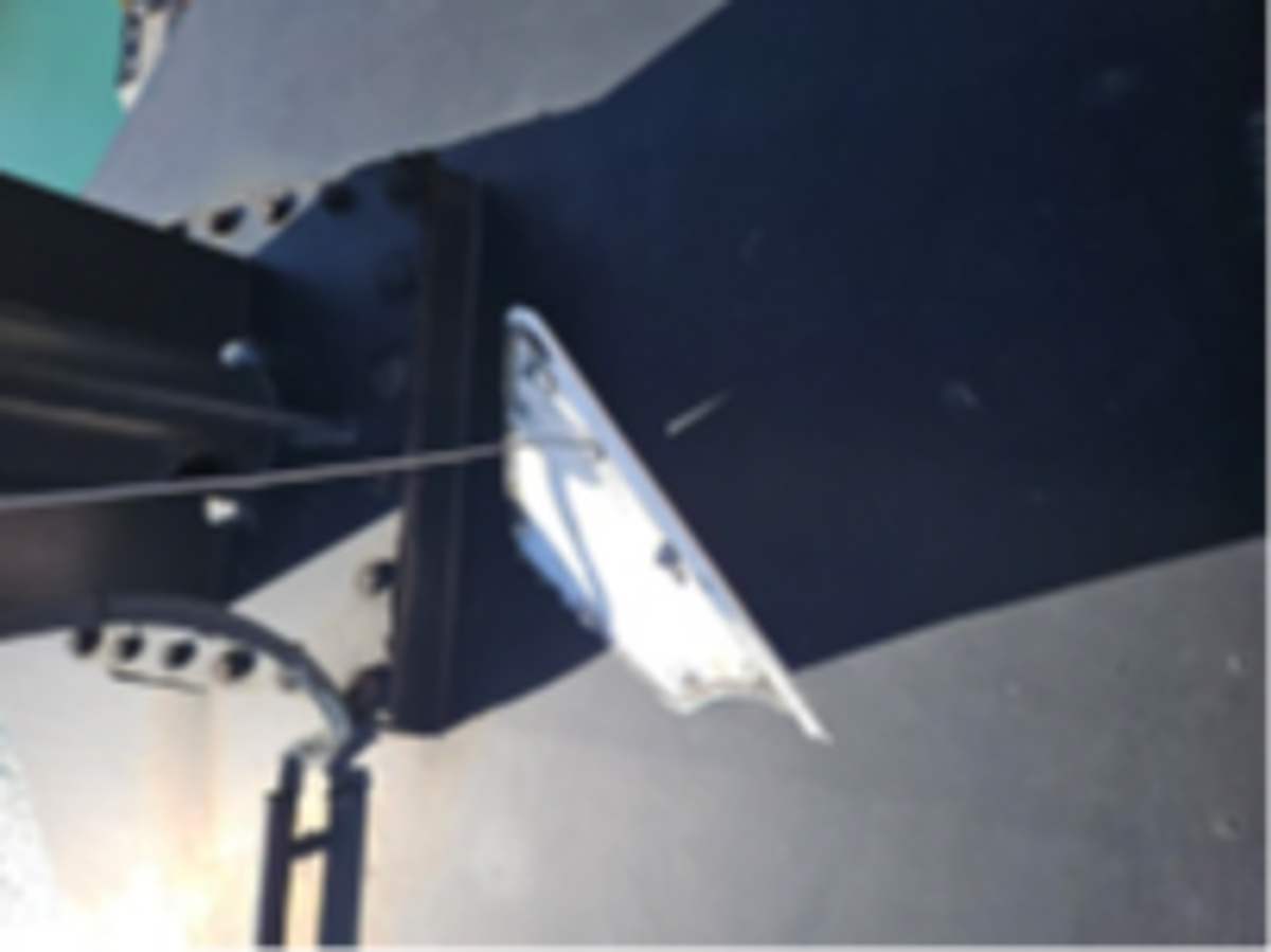 Hatch cover with new lanyard made of wire bolted on the hatch