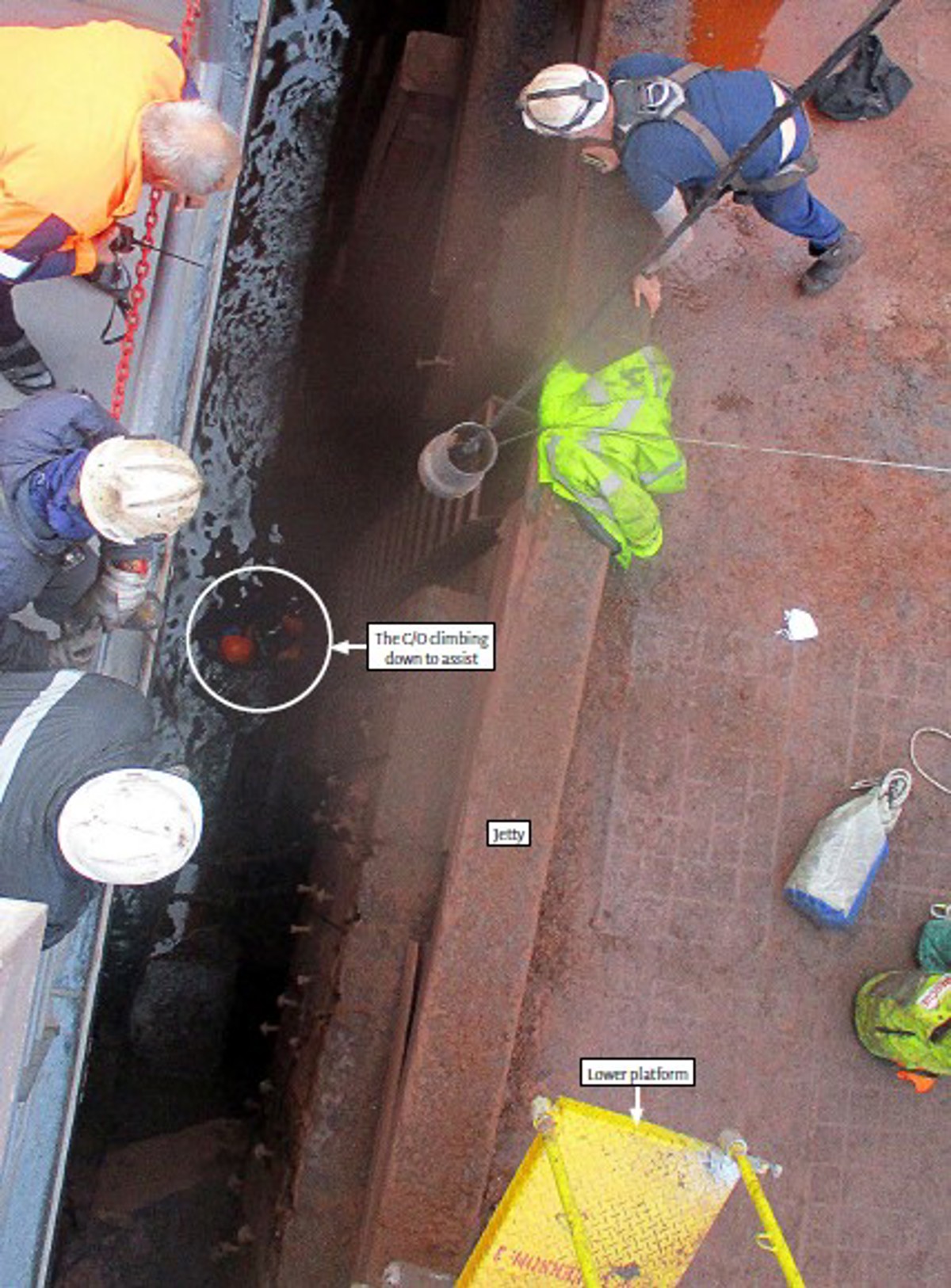 CO climbing down to assist shore worker 