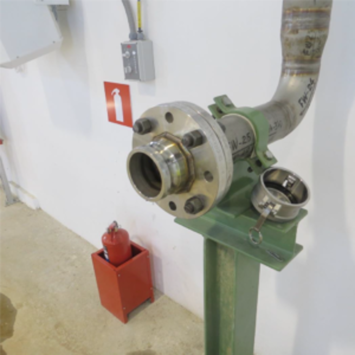 A fire main dust cap was blown off by pressure from the line and hit the wall 10 m away