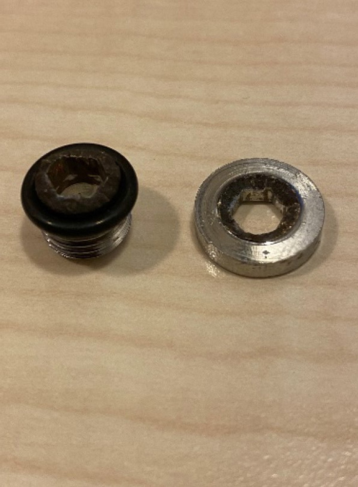The two pieces of the failed blanking plug