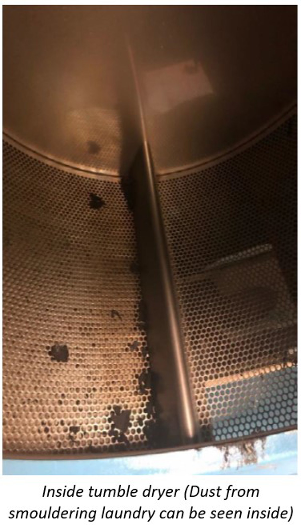 IMCA SF 32/20: Smouldering fire in tumble dryer Sf3220 22 view inside the tumble dryer (dust from smouldering laundering can be seen inside)