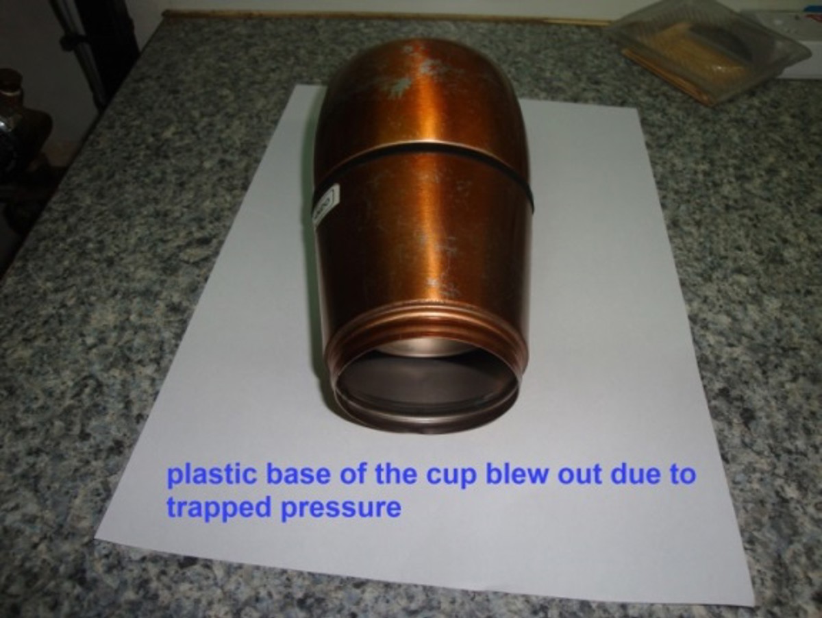 Thermos cup after explosion – plastic base of the cup blew out due to trapper pressure