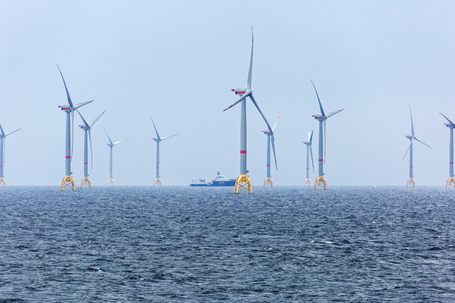 Photo of vessel near an offshore wind farm