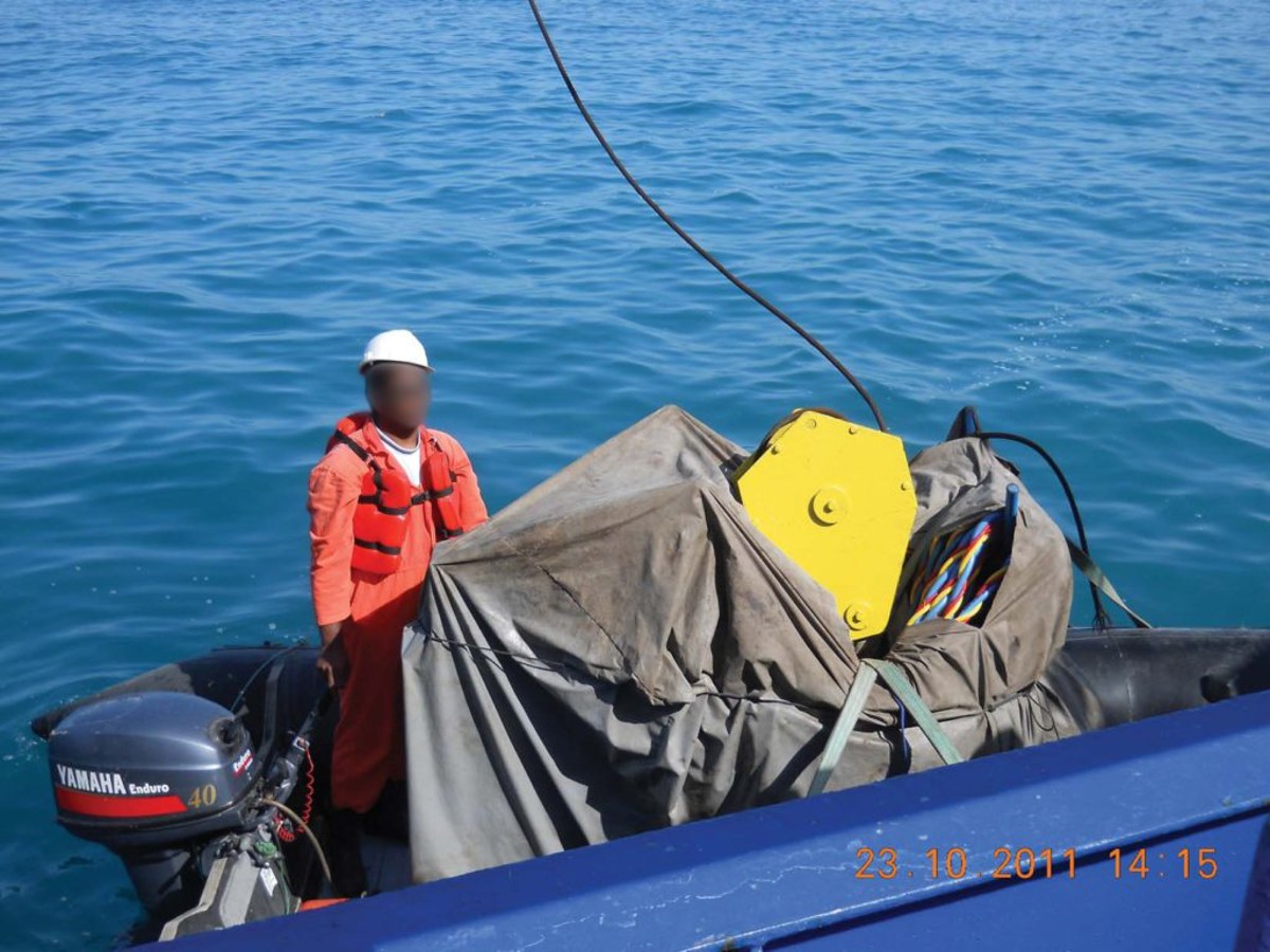 crane block landed in small boat
