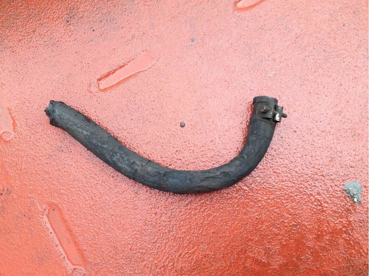 Scorched drain pipe which was immediate cause of fire