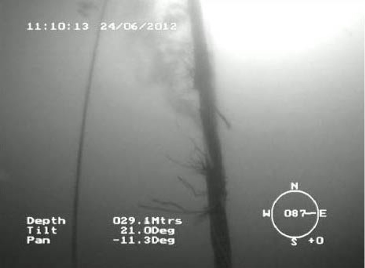 IMCA SF Near-miss: Bell umbilical damage incident View from ROV showing damaged umbilical leaking gas