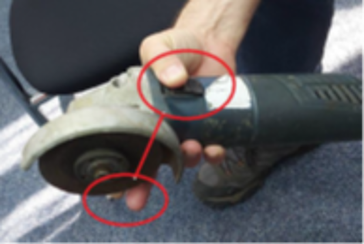 Showing INCORRECT way in which injured person picked up the grinder