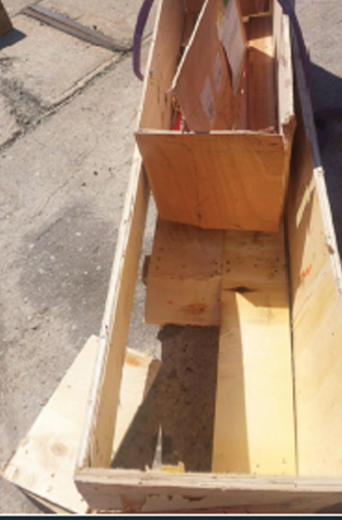 Dropped object: unsecured cargo inside box broke lose and fell