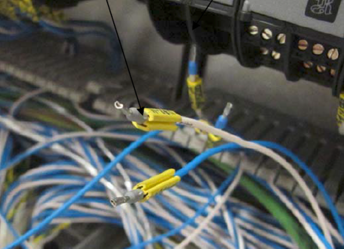 White cable that touched the electricians hand causing electric shock