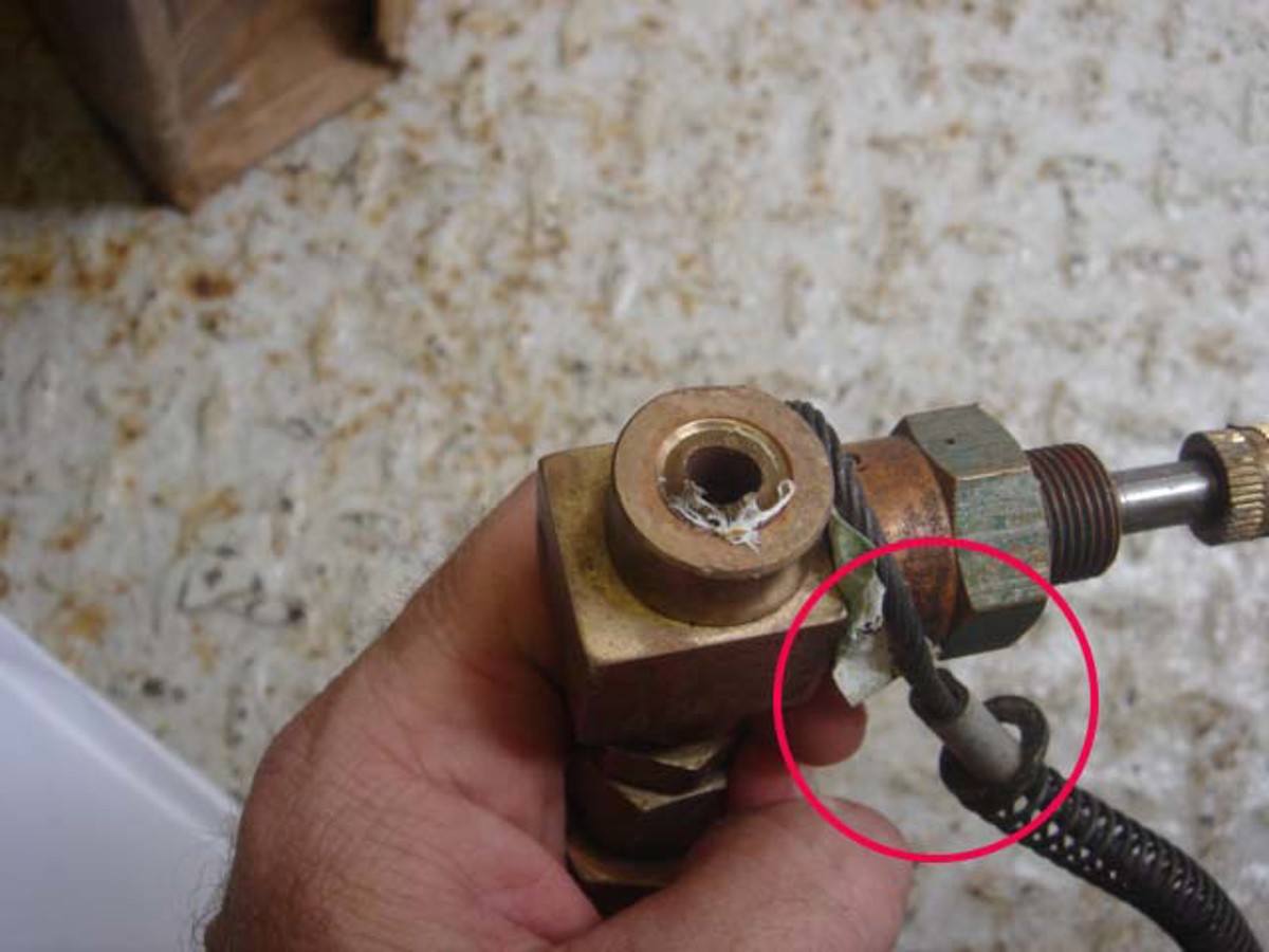 ¼” NPT nipple snapped off from diver charging manifold (whip check still in its anchoring position circled)