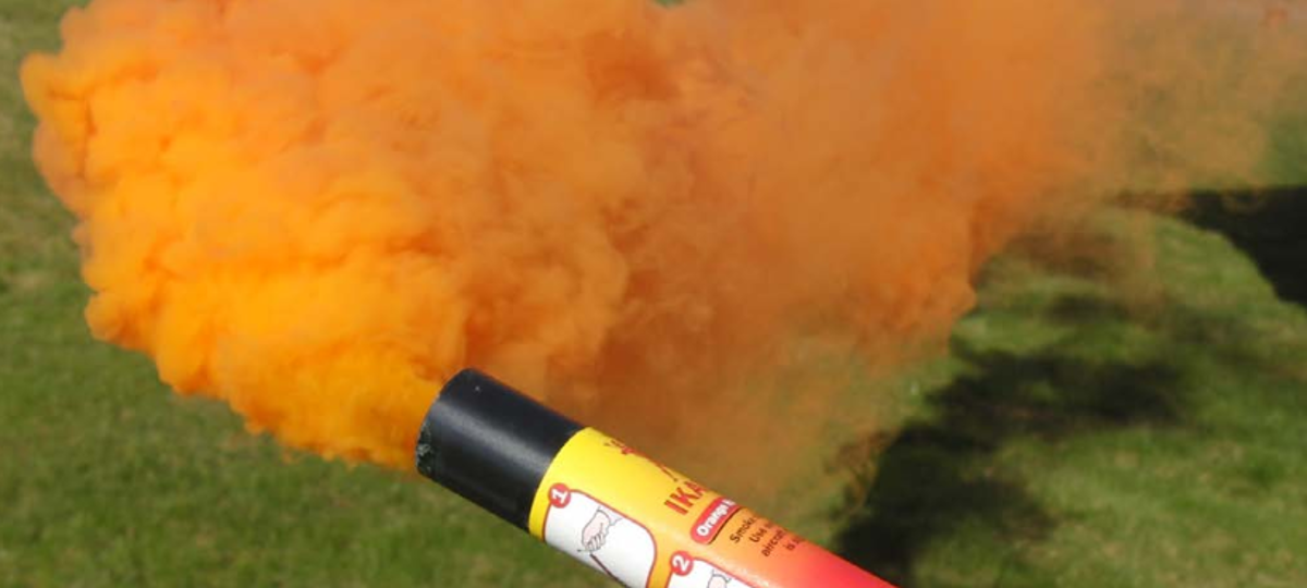 Orange smoke hand distress signals