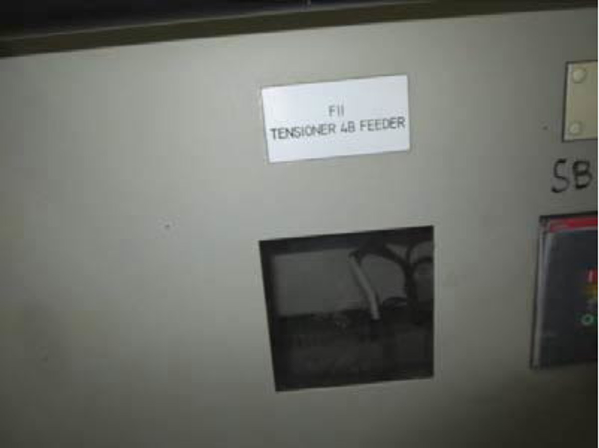 Blanks on the switchboard panel where breakers had been removed