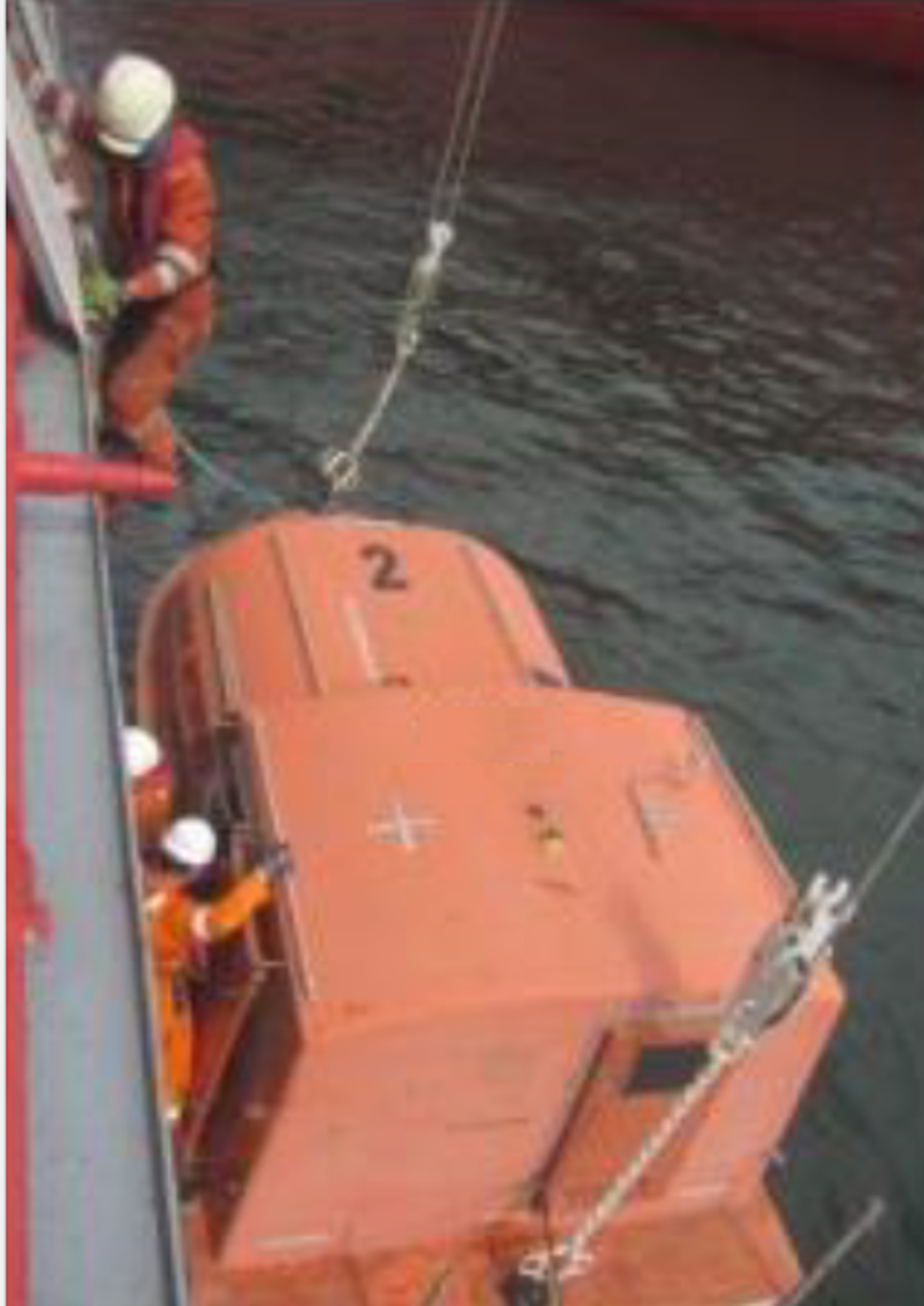 Chief Officer slipped and fell from pilot ladder onto a lifeboat, suffering minor bruising