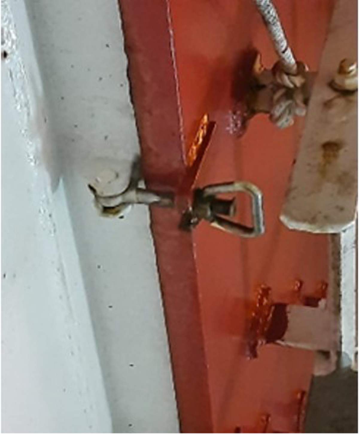 Unable to release one butterfly nut Two crew members were releasing the securing butterfly nuts on the fire flap for the emergency generator. The final nut would not release owing to air pressure on the flap. A rope was attached to the hatch and pulled to reduce the pressure, to allow the butterfly nut to be released and to prevent potential uncontrolled swing of the hatch due to pressure build up