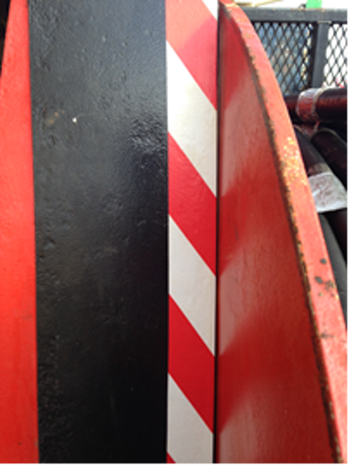 Added strip of additional guarding and safety tape to highlight potential ‘pinch’ points to operators