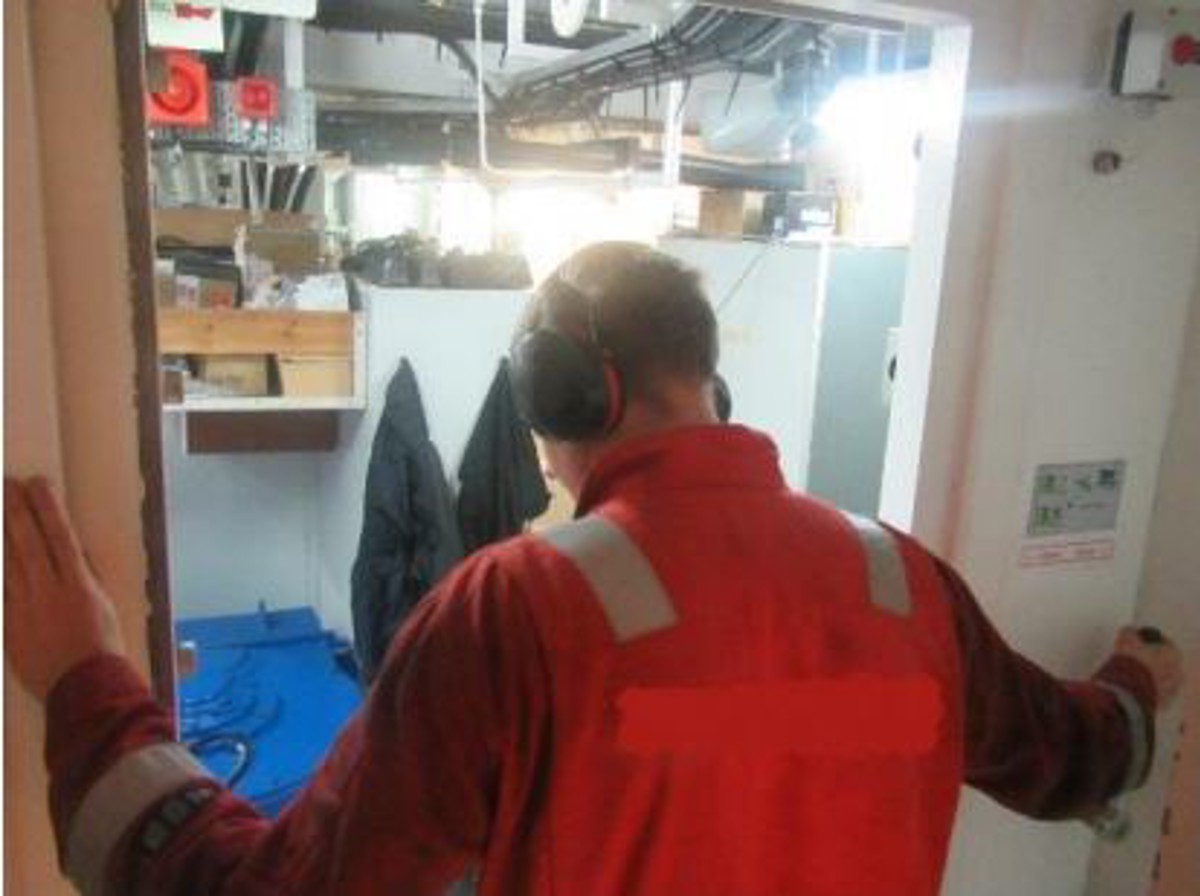 Crewman in watertight door frame